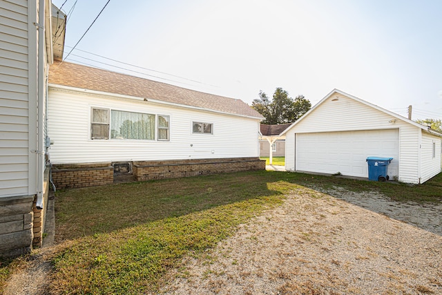 view of home's exterior with an outdoor structure and a garage