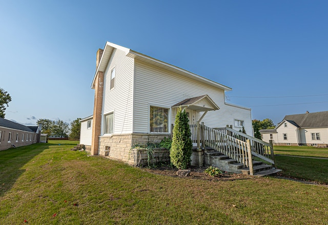 view of home's exterior with a lawn