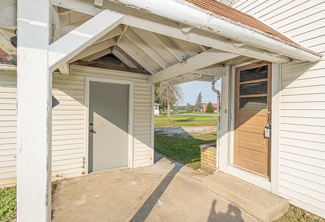 entrance to property featuring a patio area