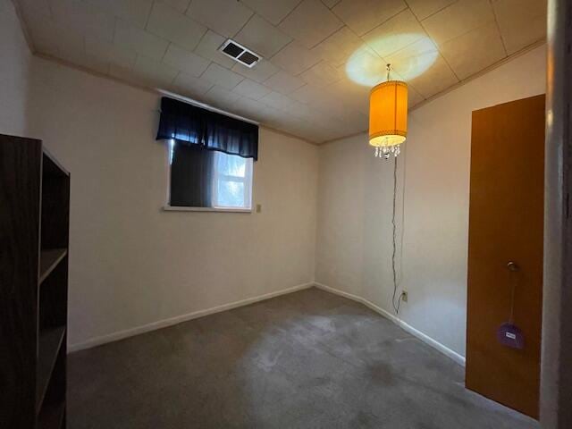 basement with dark colored carpet