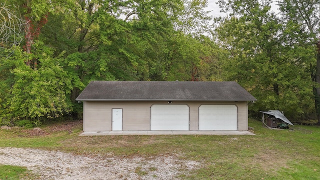 garage with a lawn