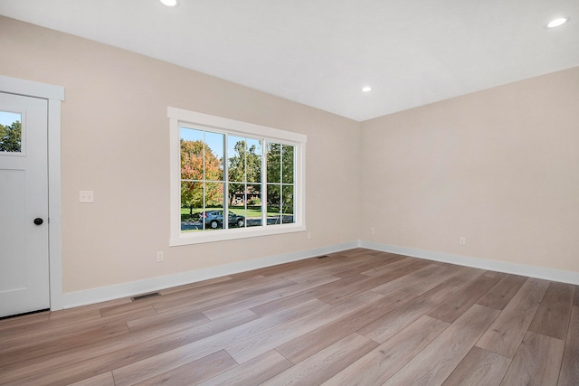 unfurnished room featuring light hardwood / wood-style floors