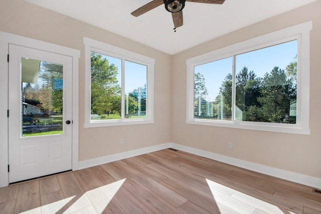 interior space with ceiling fan and plenty of natural light