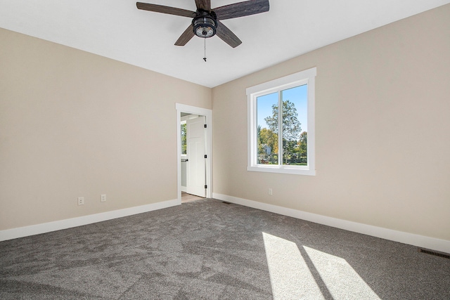 carpeted empty room with ceiling fan