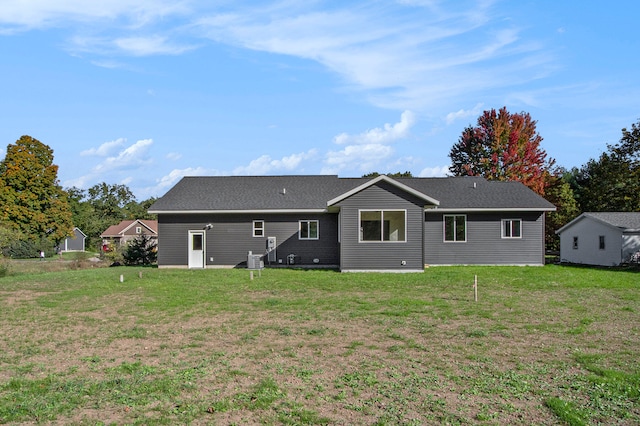 rear view of house with a lawn