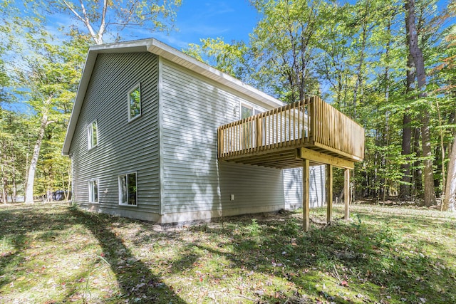 view of property exterior featuring a wooden deck