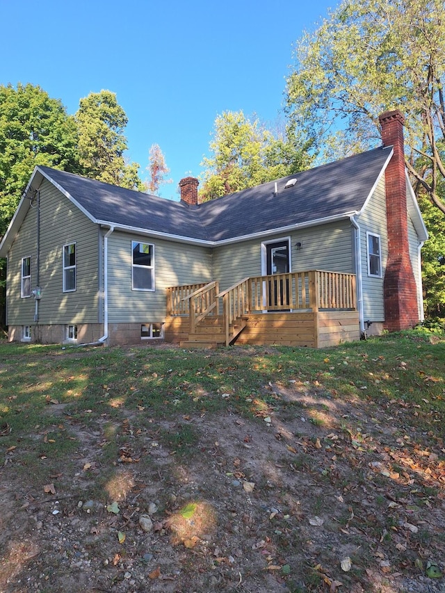 back of house featuring a wooden deck