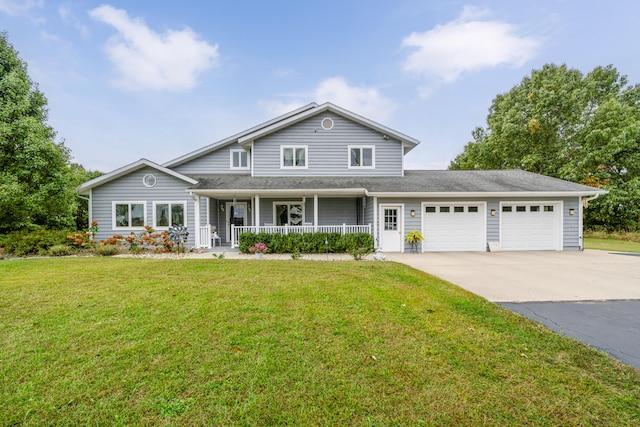 view of front of home with a garage, a front lawn, and a porch