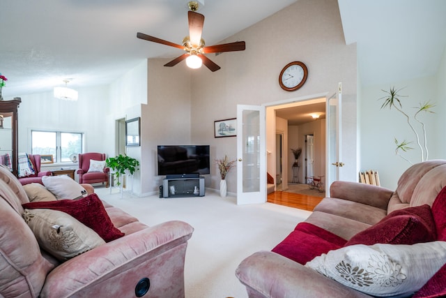 living room featuring light carpet, high vaulted ceiling, and ceiling fan