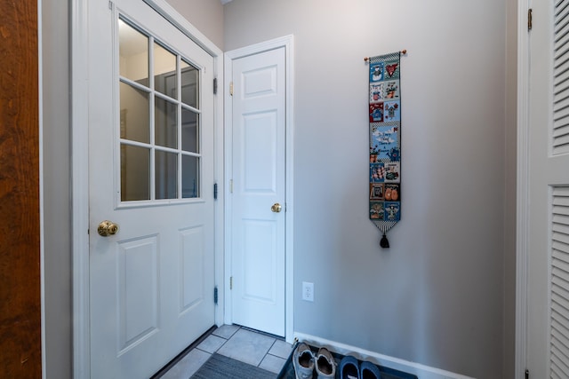 doorway featuring light tile patterned floors