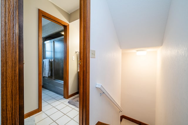 hall featuring light tile patterned floors