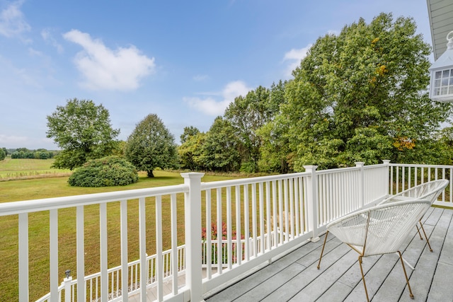 wooden terrace with a yard