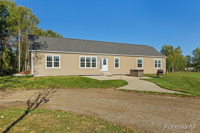 view of front of property with a patio area and a front yard