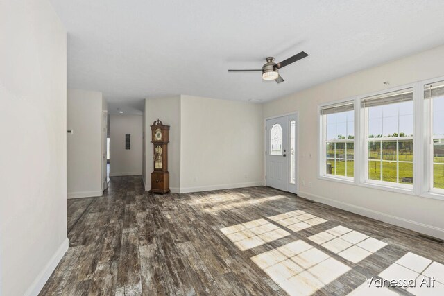 spare room with ceiling fan and dark hardwood / wood-style floors