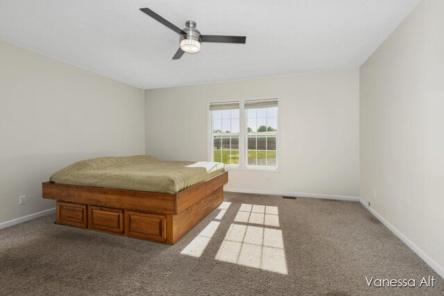 unfurnished bedroom featuring carpet flooring and ceiling fan