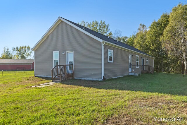 rear view of house with a lawn