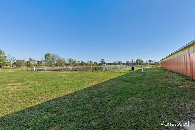 view of yard with a rural view