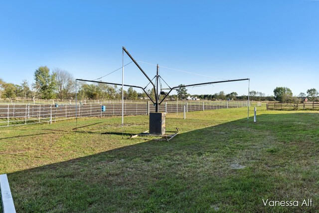 view of yard with a rural view