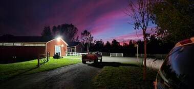 view of yard at dusk