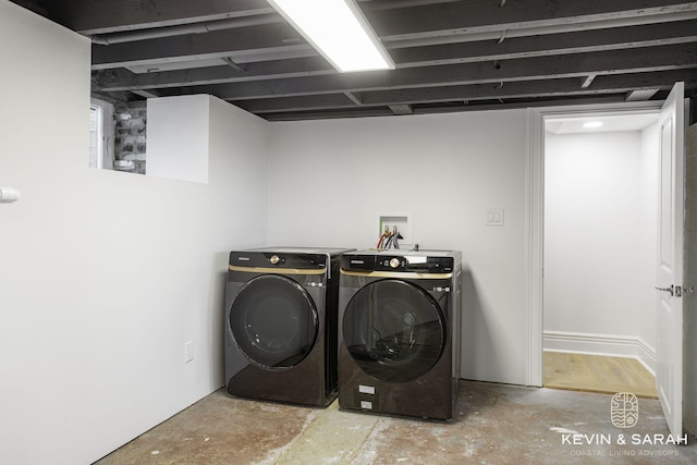 clothes washing area featuring washer and dryer