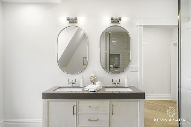 bathroom featuring vanity and wood-type flooring