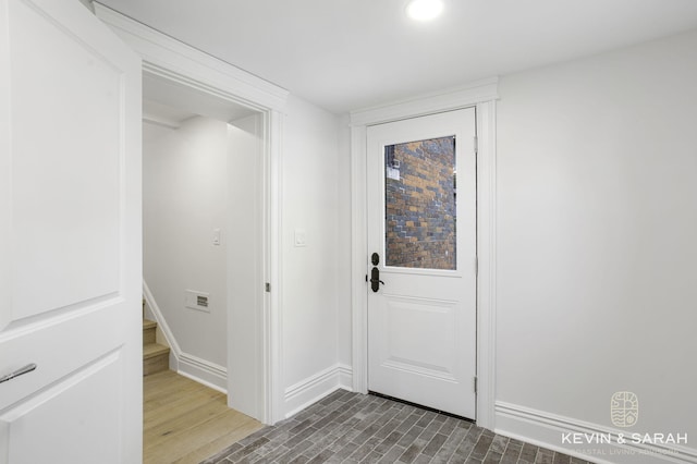 entryway with dark hardwood / wood-style floors