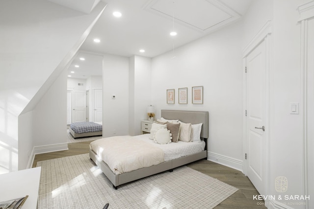 bedroom with hardwood / wood-style floors