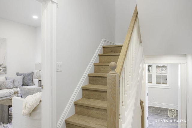 stairs with hardwood / wood-style floors