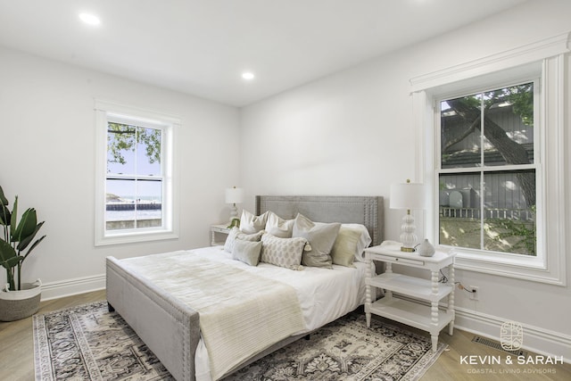 bedroom with hardwood / wood-style flooring