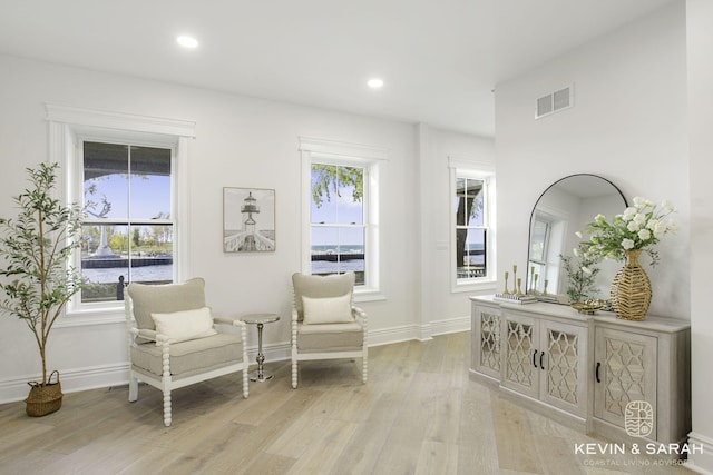 sitting room featuring light hardwood / wood-style floors