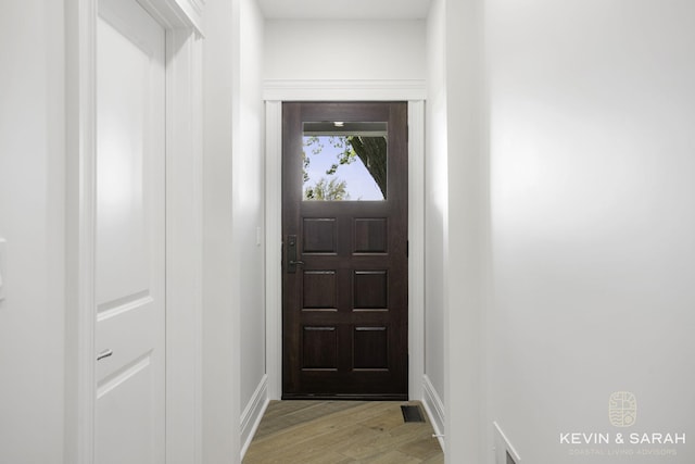 doorway with light hardwood / wood-style flooring