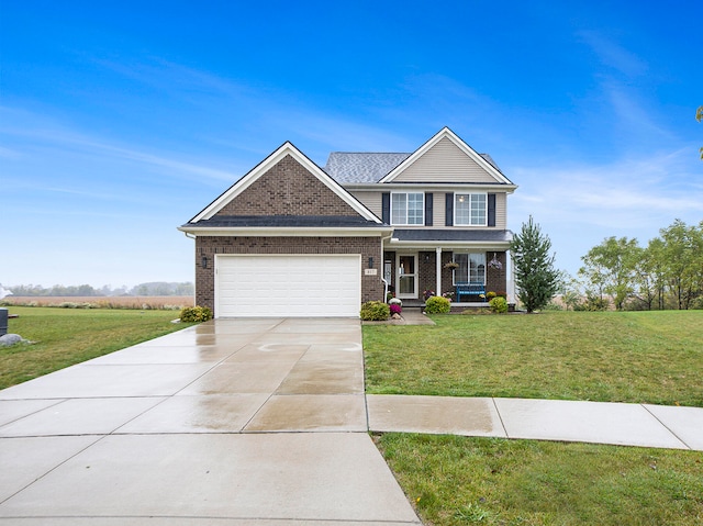 view of front of home featuring covered porch, a garage, and a front yard