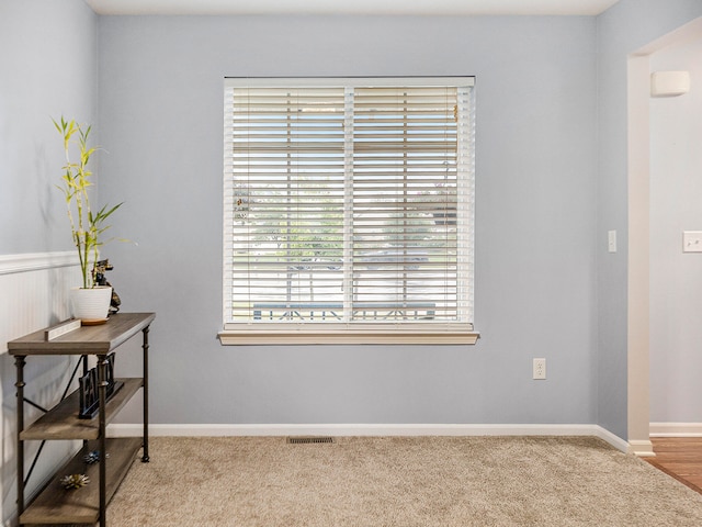 interior space featuring light colored carpet