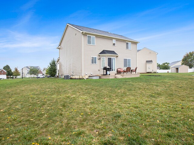 back of property featuring a yard, a patio, and cooling unit