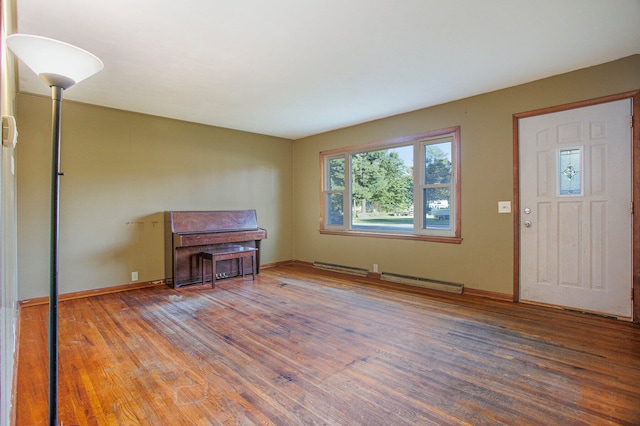 entrance foyer with dark wood-type flooring and baseboard heating