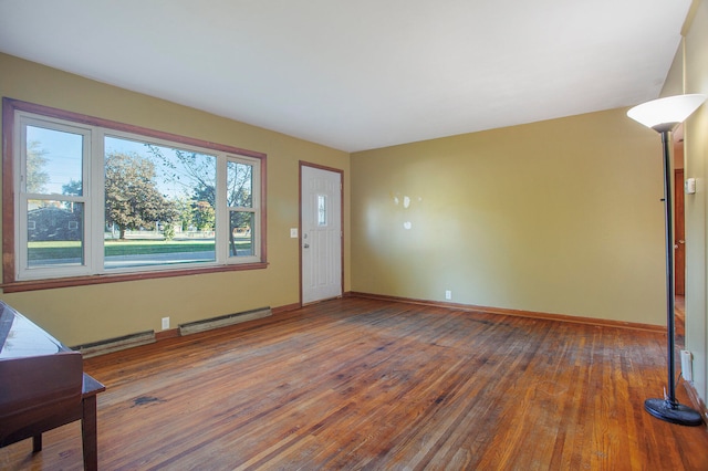 interior space featuring wood-type flooring and a baseboard radiator