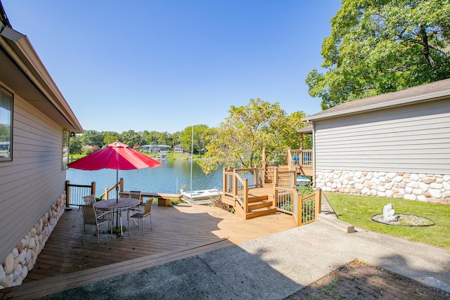 deck featuring a water view