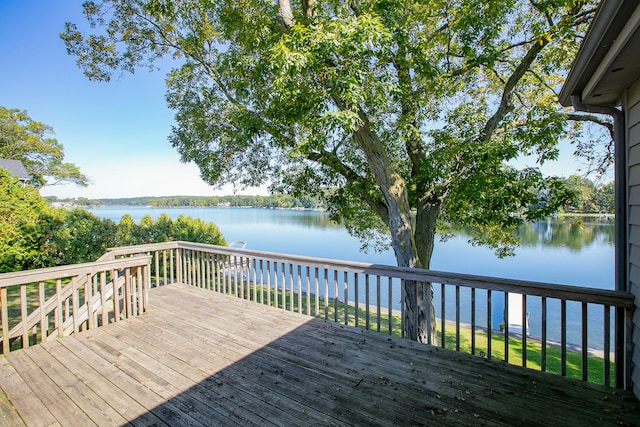 deck featuring a water view