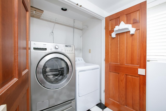 laundry area with independent washer and dryer