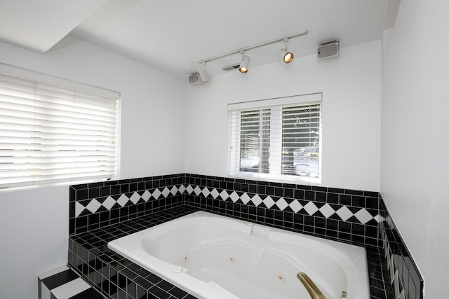 bathroom with tiled bath