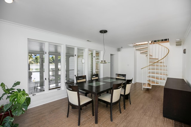 dining area with crown molding and dark hardwood / wood-style floors