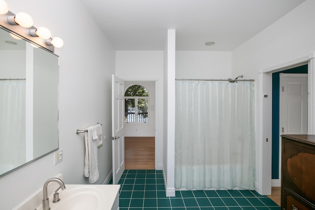 bathroom featuring tile patterned flooring and vanity