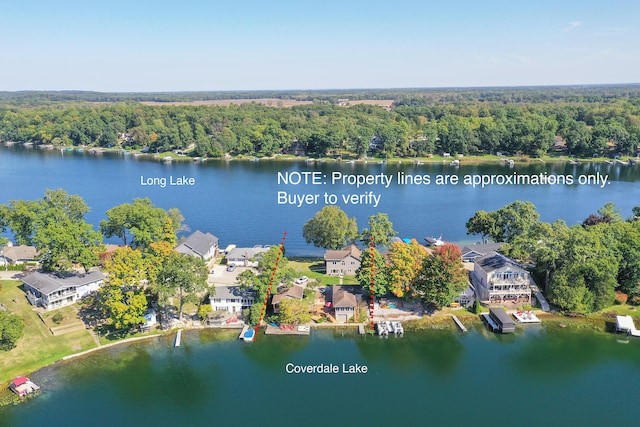 birds eye view of property with a water view