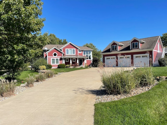 view of front of home featuring a garage and a front lawn