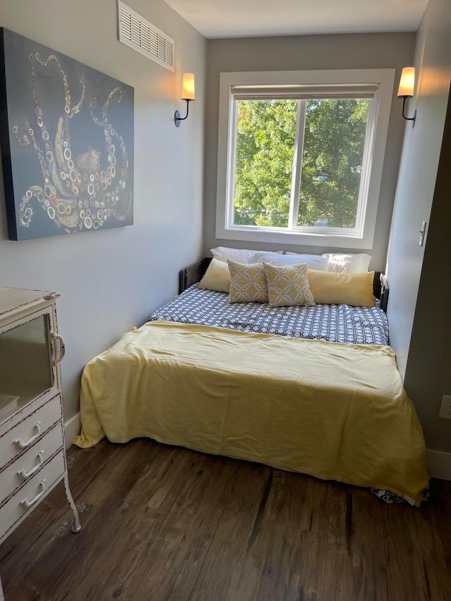 bedroom featuring dark hardwood / wood-style floors