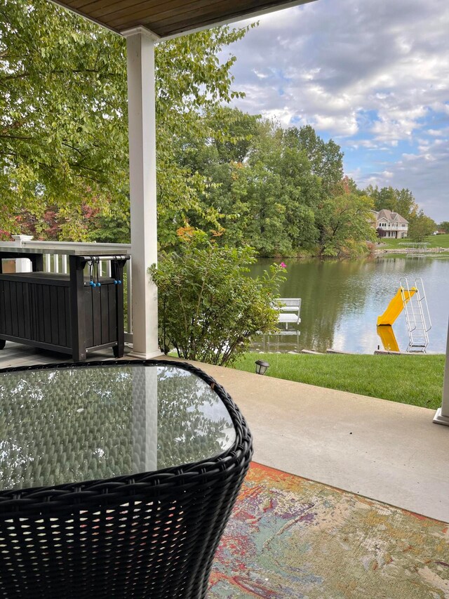 view of patio featuring a water view