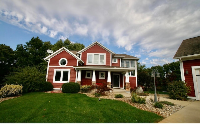 craftsman-style home with a porch and a front lawn