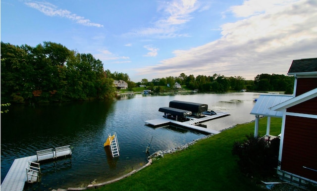 dock area featuring a yard and a water view