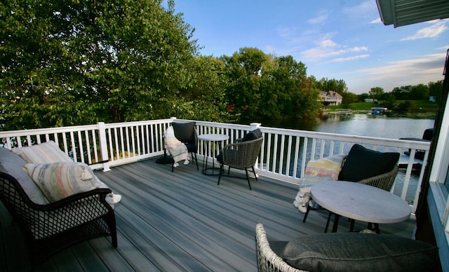 wooden terrace featuring a water view