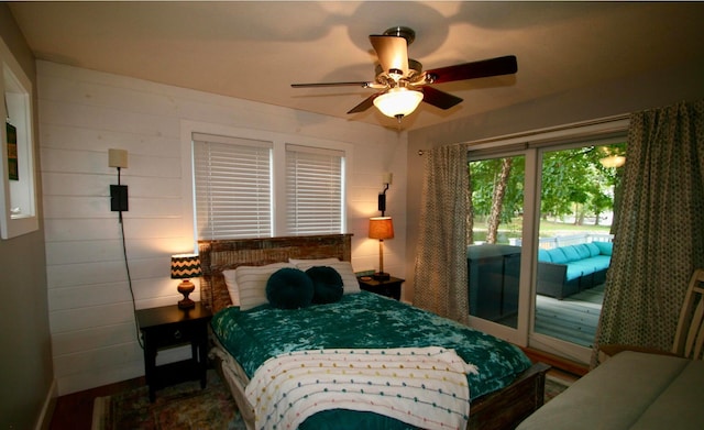 bedroom featuring ceiling fan and access to outside